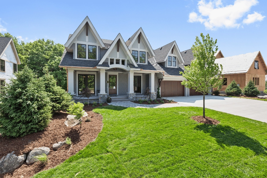 beautiful home with nice landscaping and a freshly mowed lawn